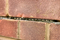Stitching Anchor - installed in masonry wall.