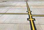 Cuts sealant materils from airport runways.